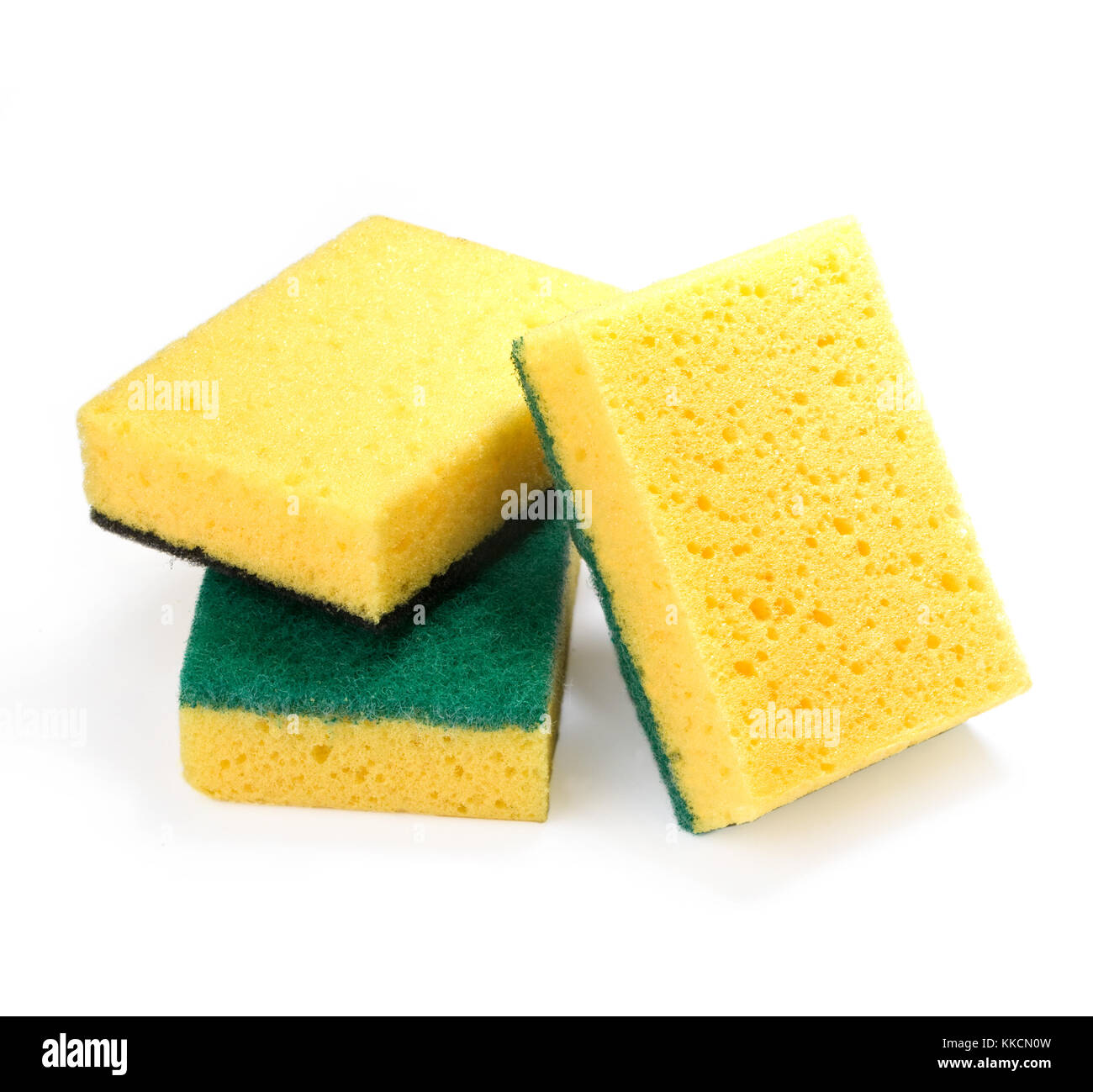 Yellow sponges for washing utensils on a white background Stock Photo