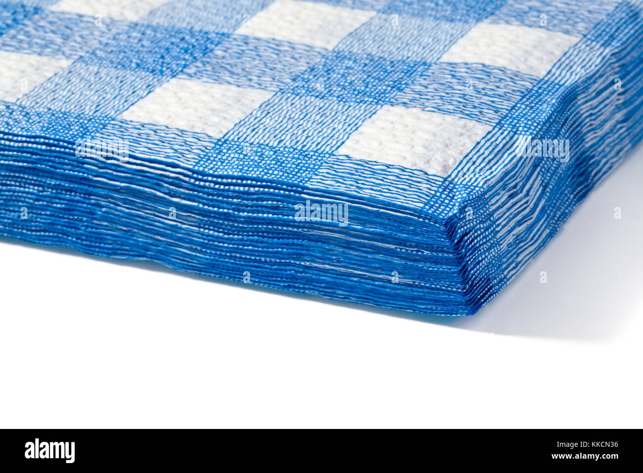 a stack of white cloth in a blue cell close-up on white background Stock Photo