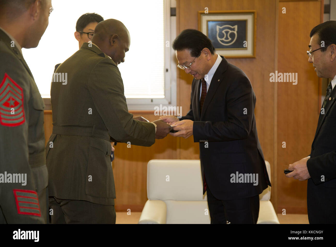 U.S. Marine Corps Lt. Col. Leroy Bryant Butler, battalion commander, 3rd Battalion, 12th Marine Regiment, meets with Mr. Kozo Sone, Mayor of Betsukai, during the Artillery Relocation Training Program (ARTP) 17-3 at Betsukai, Hokkaido, Japan on November 27, 2017. ARTP 17-3 is an annual training exercise that helps Marines to sustain and improve occupational and common skills through simulated real world training scenarios, enhancing their combat operational readiness and improving international relationships through the U.S.-Japan Treaty of Mutual Cooperation and Security.   (U.S. Marine Corps  Stock Photo