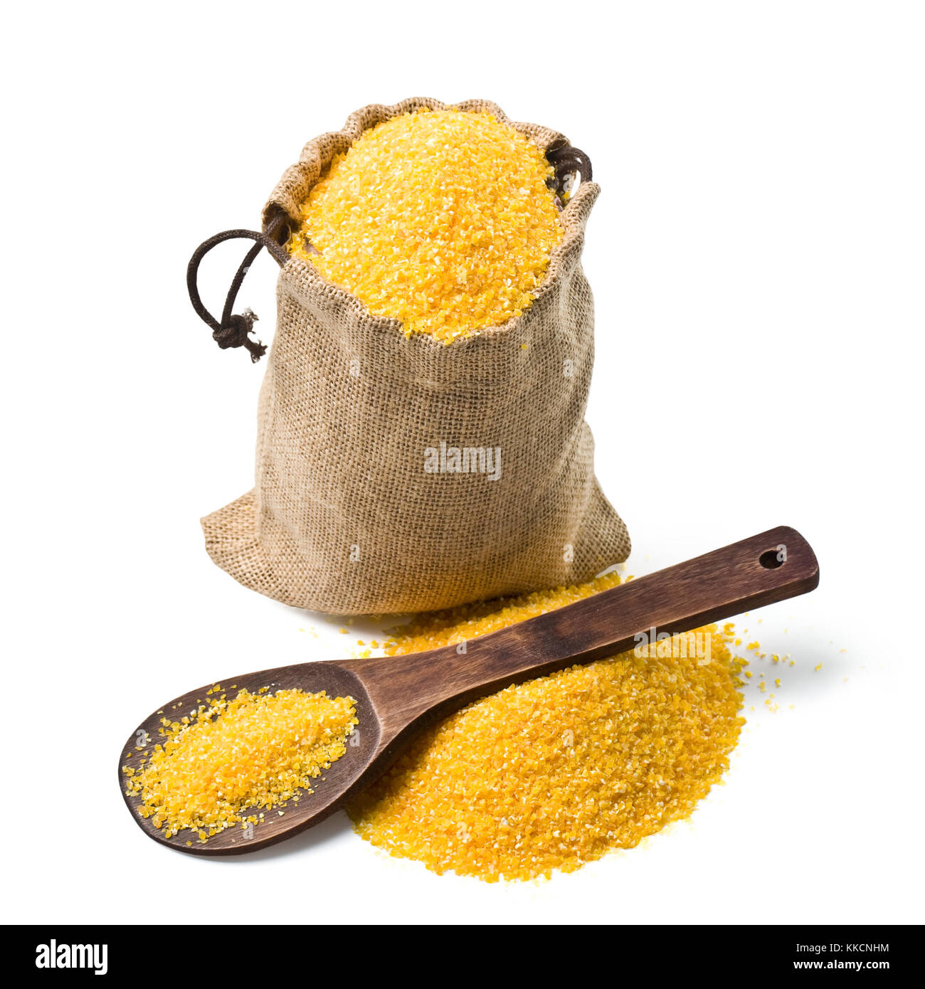 bag of ground corn and a wooden spoon on a white background. keeping paths Stock Photo