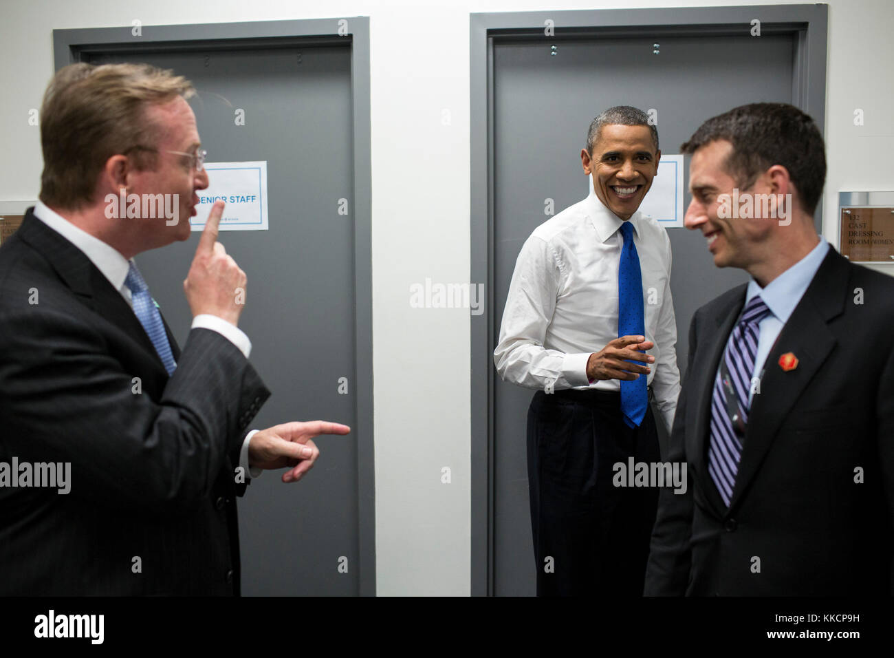 President Barack Obama jokes with Robert Gibbs and David Plouffe backstage prior to the start of the third presidential debate with GOP candidate Mitt Romney, at Lynn University in Boca Raton, Fla., Oct. 22, 2012. (Official White House Photo by Pete Souza)  This official White House photograph is being made available only for publication by news organizations and/or for personal use printing by the subject(s) of the photograph. The photograph may not be manipulated in any way and may not be used in commercial or political materials, advertisements, emails, products, promotions that in any way  Stock Photo