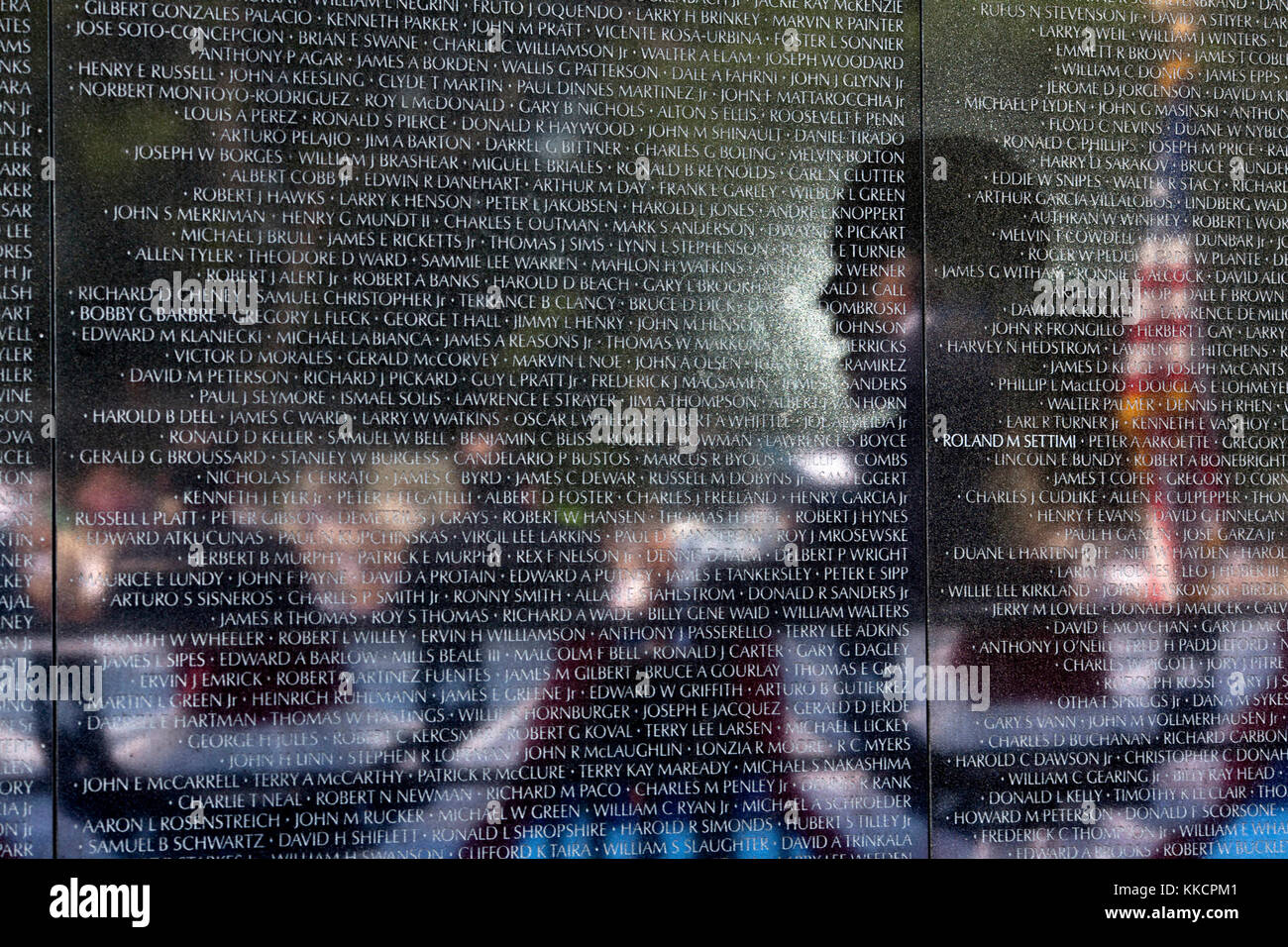 President Barack Obama is reflected in the Vietnam Veterans Memorial wall as he delivers remarks during the 50th Anniversary of the Vietnam War commemoration ceremony in Washington, D.C., May 28, 2012. (Official White House Photo by Pete Souza)  This official White House photograph is being made available only for publication by news organizations and/or for personal use printing by the subject(s) of the photograph. The photograph may not be manipulated in any way and may not be used in commercial or political materials, advertisements, emails, products, promotions that in any way suggests app Stock Photo