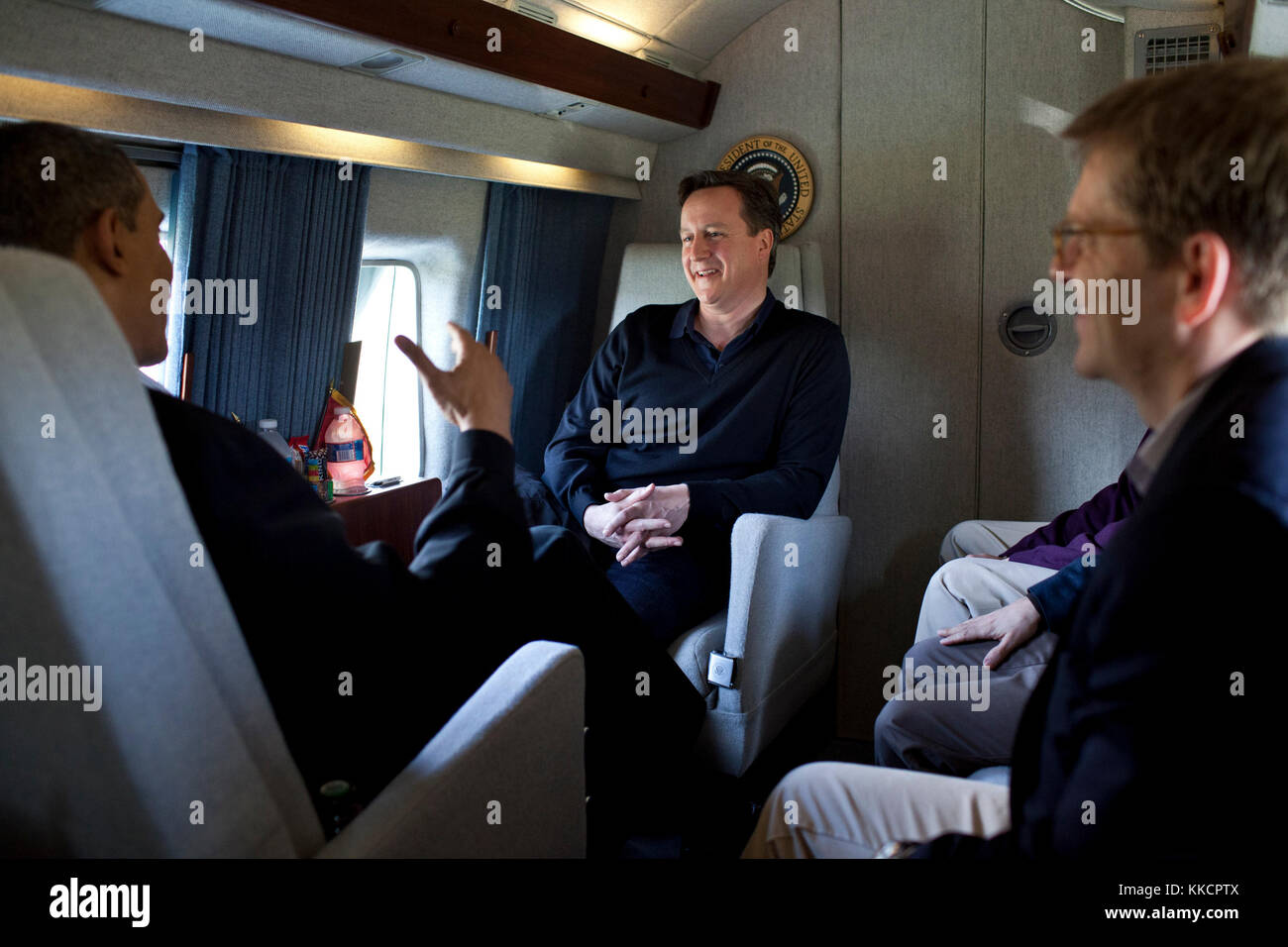 President Barack Obama talks with Prime Minister David Cameron of the United Kingdom aboard Marine One en route to Joint Base Andrews, Md., before traveling on to Dayton, Ohio, March 13, 2012. Stock Photo