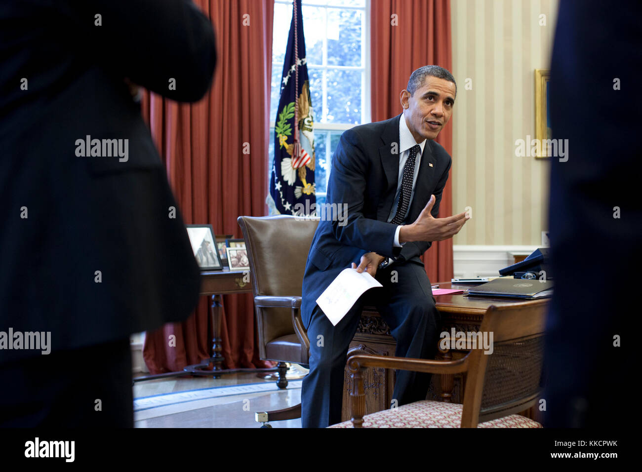President Barack Obama talks with senior advisors in the Oval Office, Feb. 29, 2012. Stock Photo
