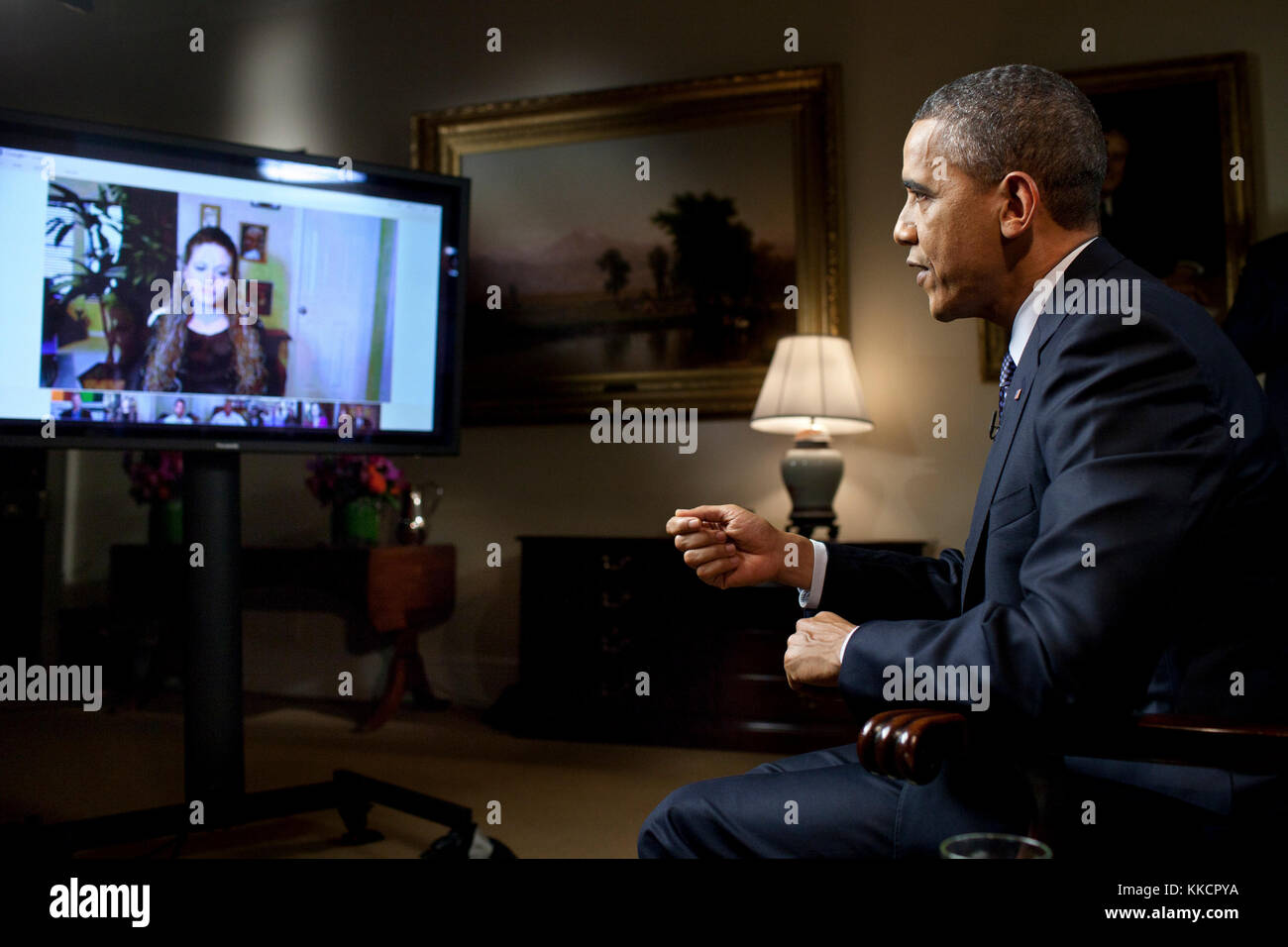 President Barack Obama participates in an interview with YouTube and Google+ to discuss his State of the Union Address, in the Roosevelt Room of the White House, Jan. 30, 2012. The interview was held through a Google+ Hangout, making it the first completely virtual interview from the White House. Stock Photo