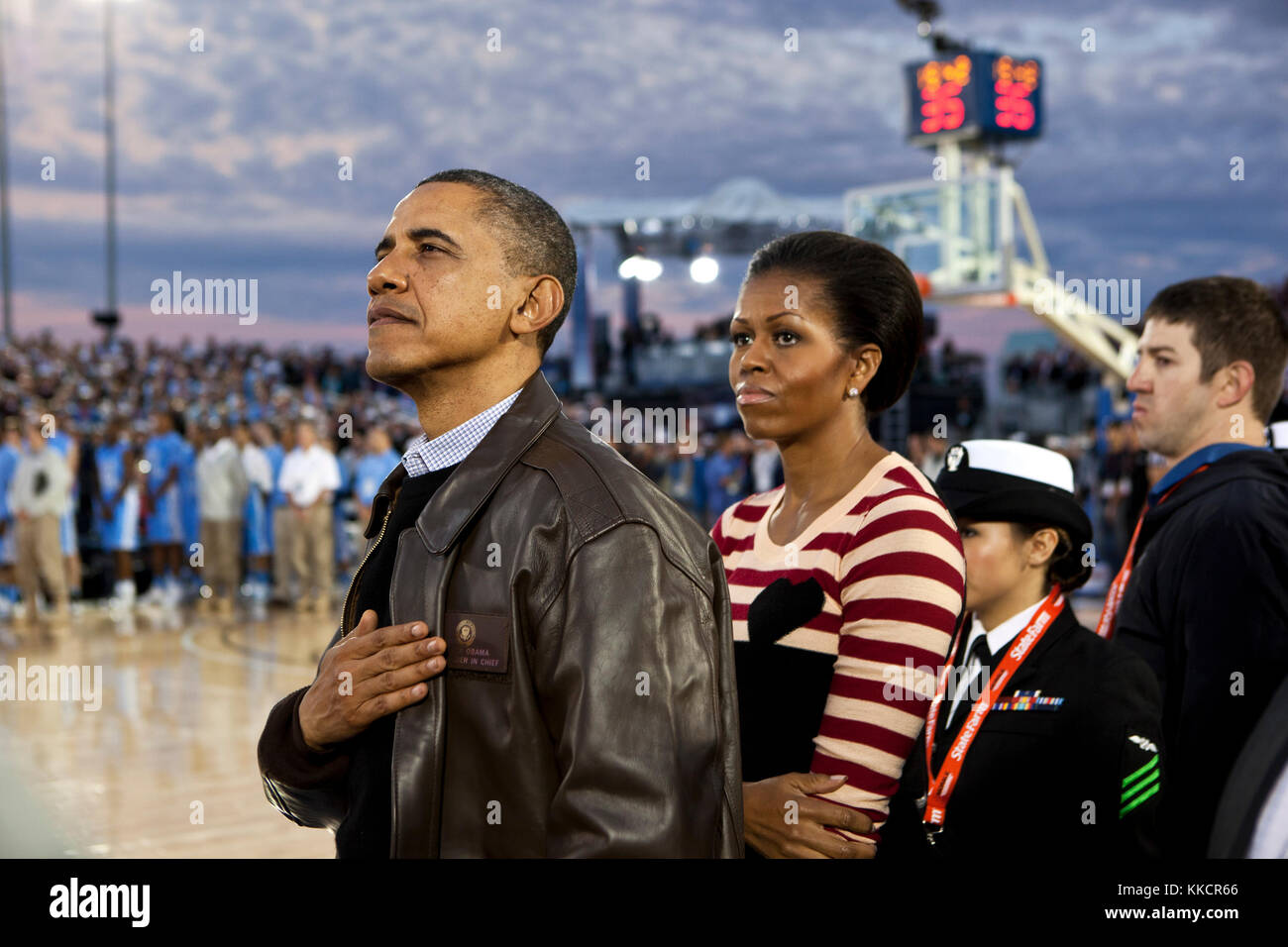 President Barack Obama and First Lady Michelle Obama watch the retiring of the colors aboard the USS Carl Vinson, docked at North Island Naval Station in San Diego, Calif., Nov. 11, 2011. Stock Photo