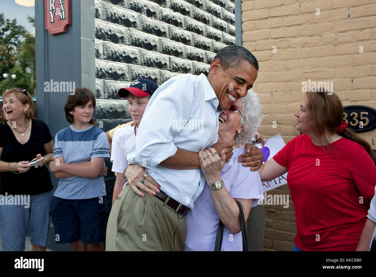 President Barack Obama greets people outside the Old Market Deli in Cannon Falls, Minn. Aug. 15, 2011. The President stopped to have lunch with five post-9/11 veterans from Minnesota during a three-day bus tour in the Midwest. Stock Photo