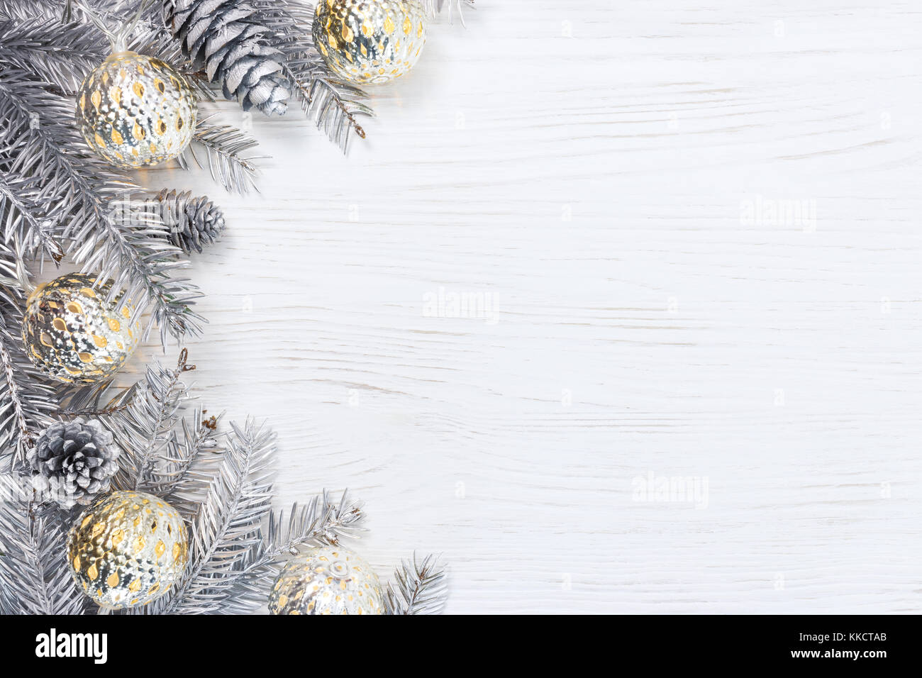 silver christmas tree branches decorated with glowing light garlands ...