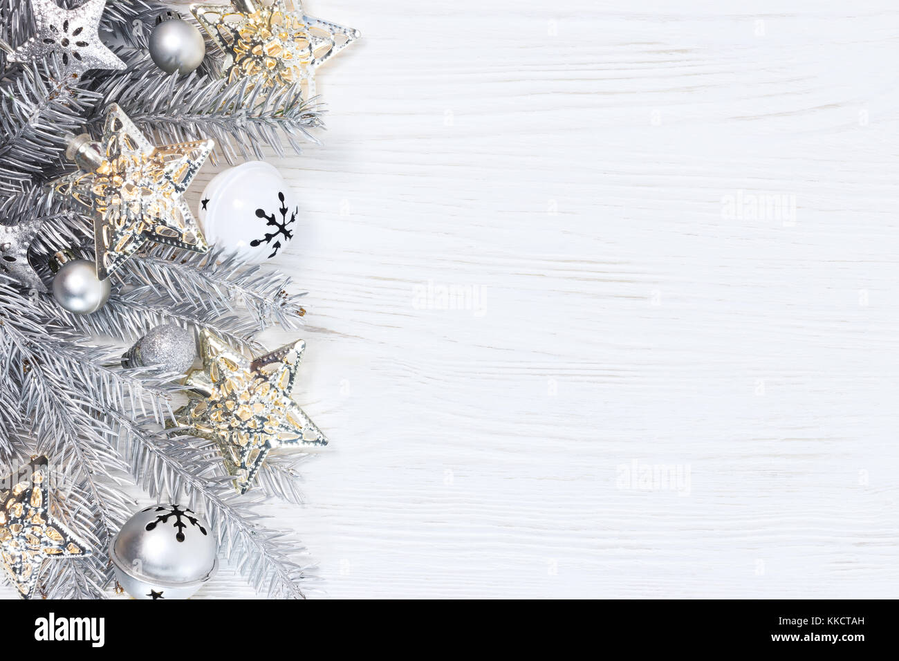 silver christmas fir tree branches with lights garlands and holiday ...