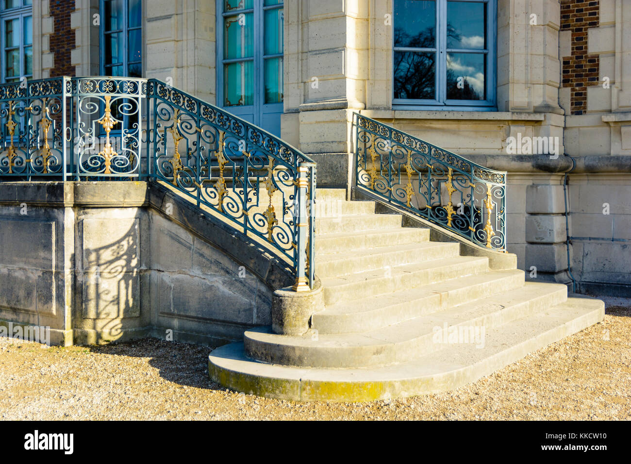 Sceaux, France - November 26, 2017: The garden side staircase of the Sceaux castle  with its wrought iron railing, by a sunny morning. Stock Photo