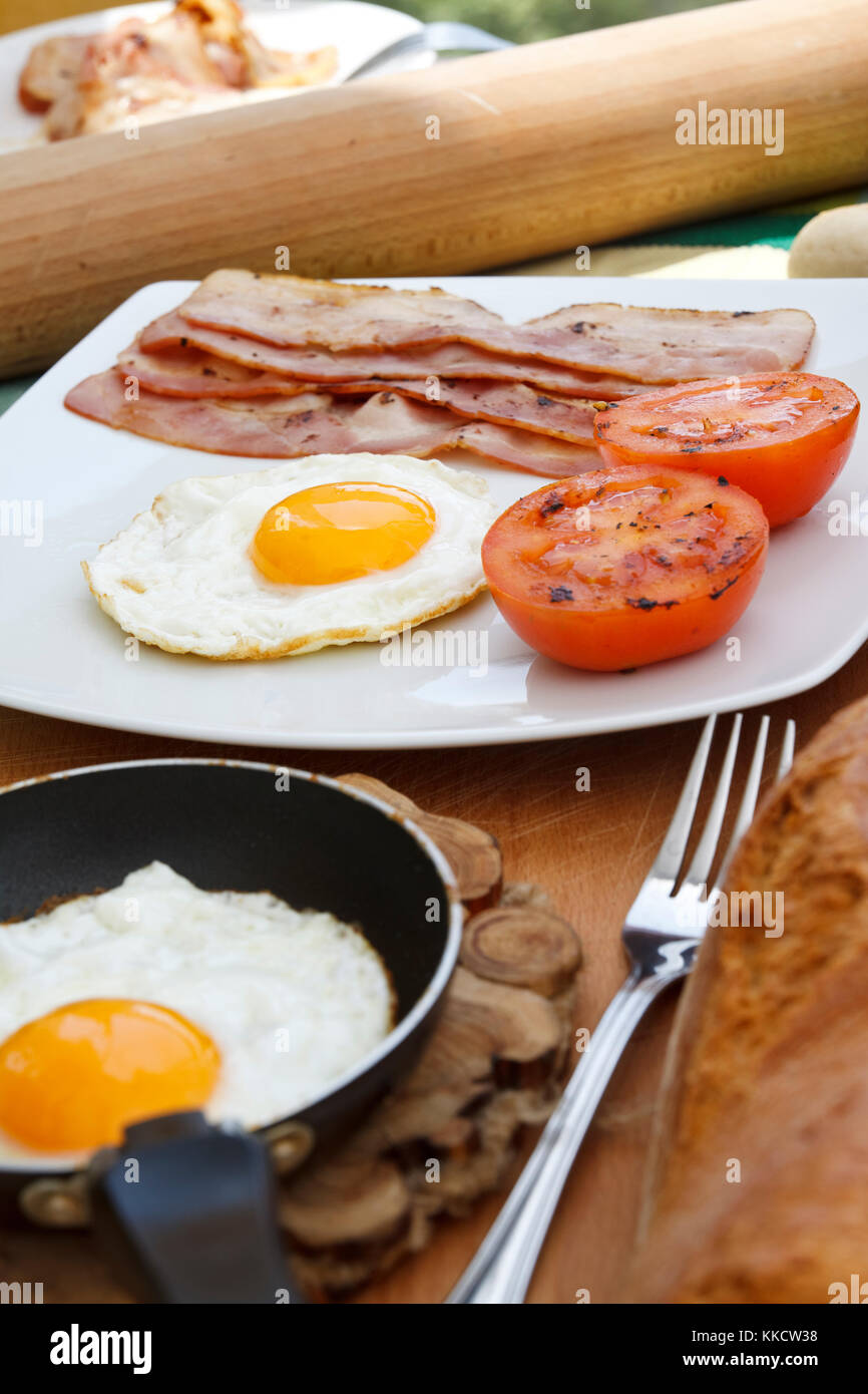 Delicious breakfast with eggs and bacon Stock Photo - Alamy