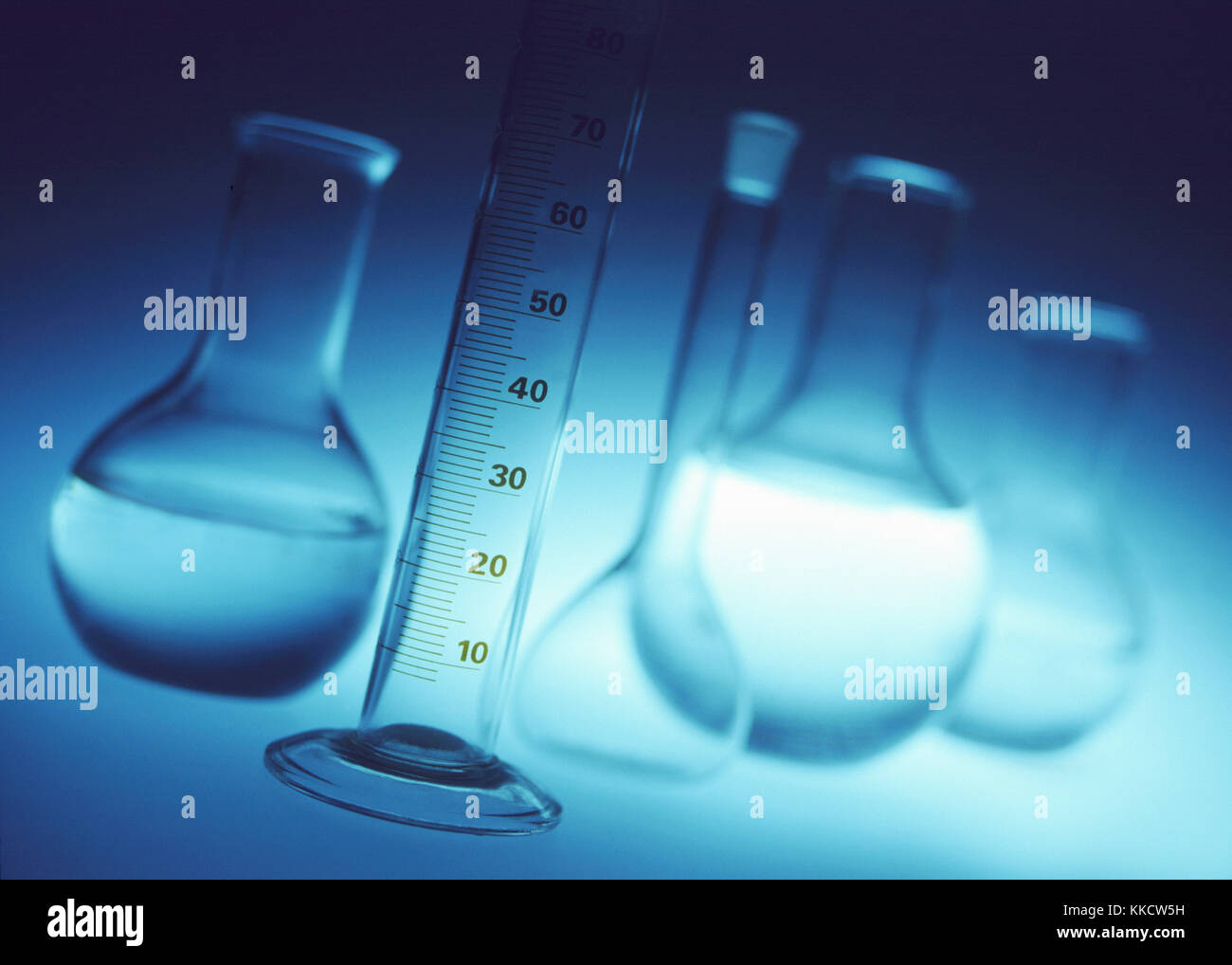 Chemical laboratory glassware measuring cylinder, volumetric and chemical flasks Stock Photo
