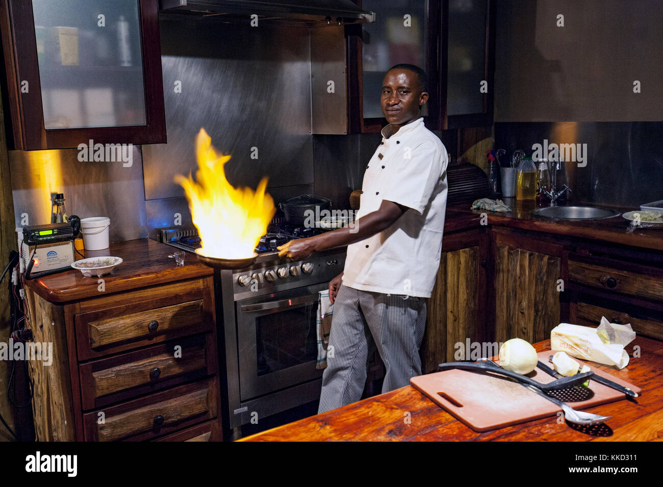 Chef cooking at Onguma Tree Top Camp, Onguma Game Reserve, Namibia, Africa Stock Photo