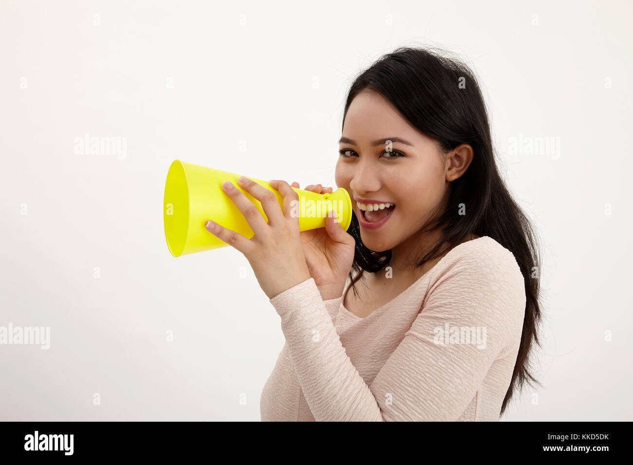malay woman using megaphone on the white background Stock Photo Alamy