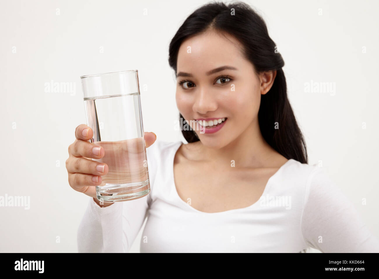 malay woman holding a glass of water Stock Photo Alamy