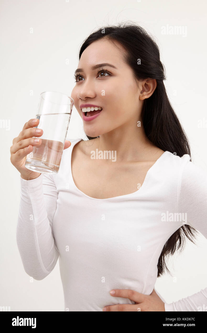 malay woman holding a glass of water Stock Photo Alamy