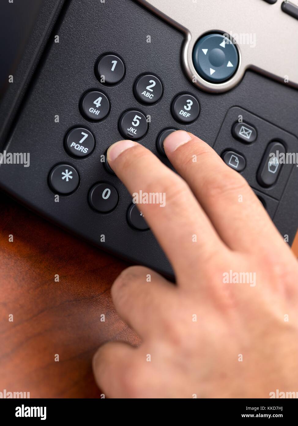 hand dialing number on black landline phone Stock Photo Alamy