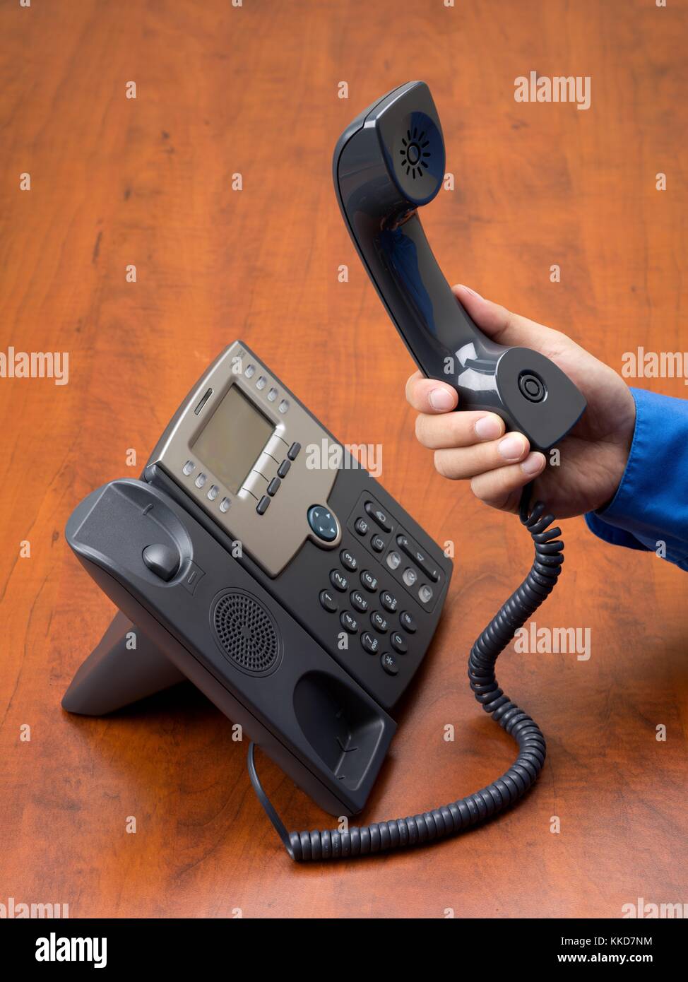 person holding telephone receiver in hand Stock Photo Alamy
