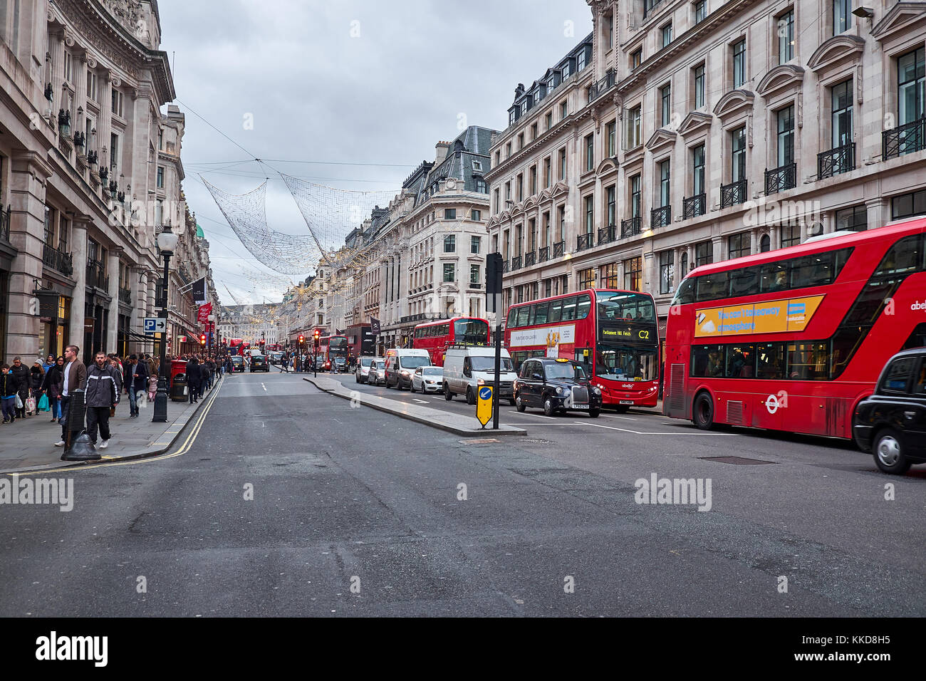 LONDON CITY - DECEMBER 23, 2016: Regent Street decorated for Christmas with a lot of traffic, both people and vehicles Stock Photo