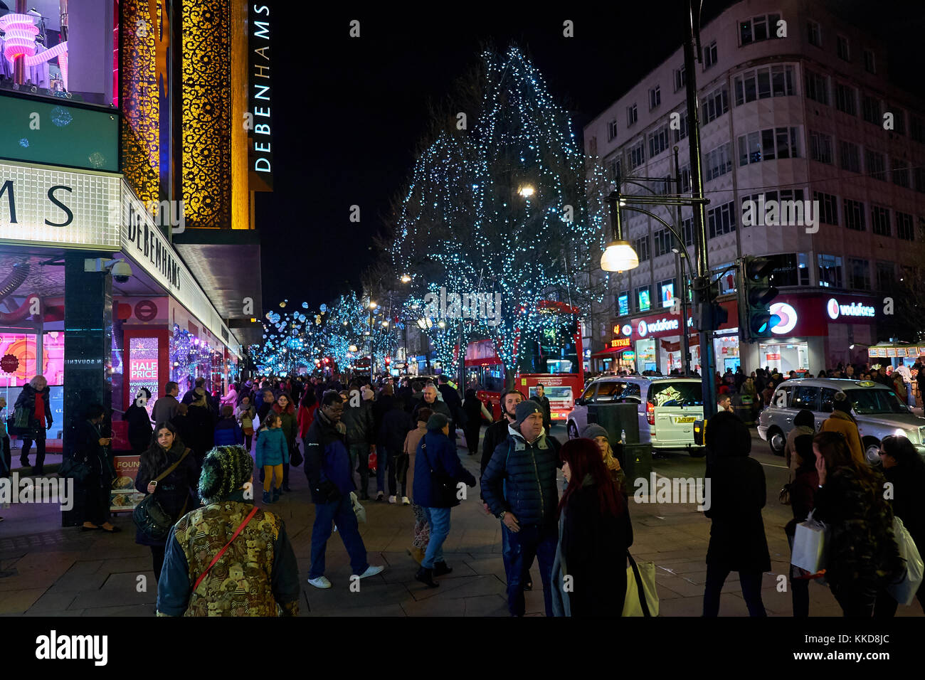 LONDON CITY - DECEMBER 24, 2016: People walking up and down Oxford Street with lots of Christmas decorations Stock Photo