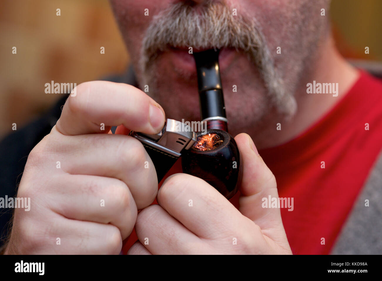 Close up of a man with a handlebar moustache and a pipe Stock Photo Alamy