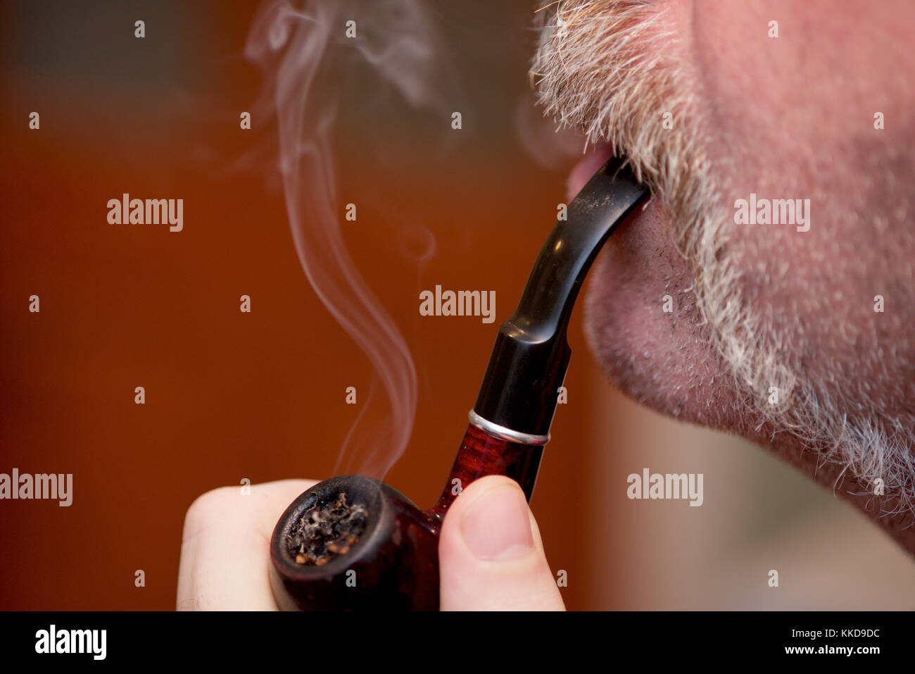 Close up of a man with a handlebar moustache and a pipe Stock Photo