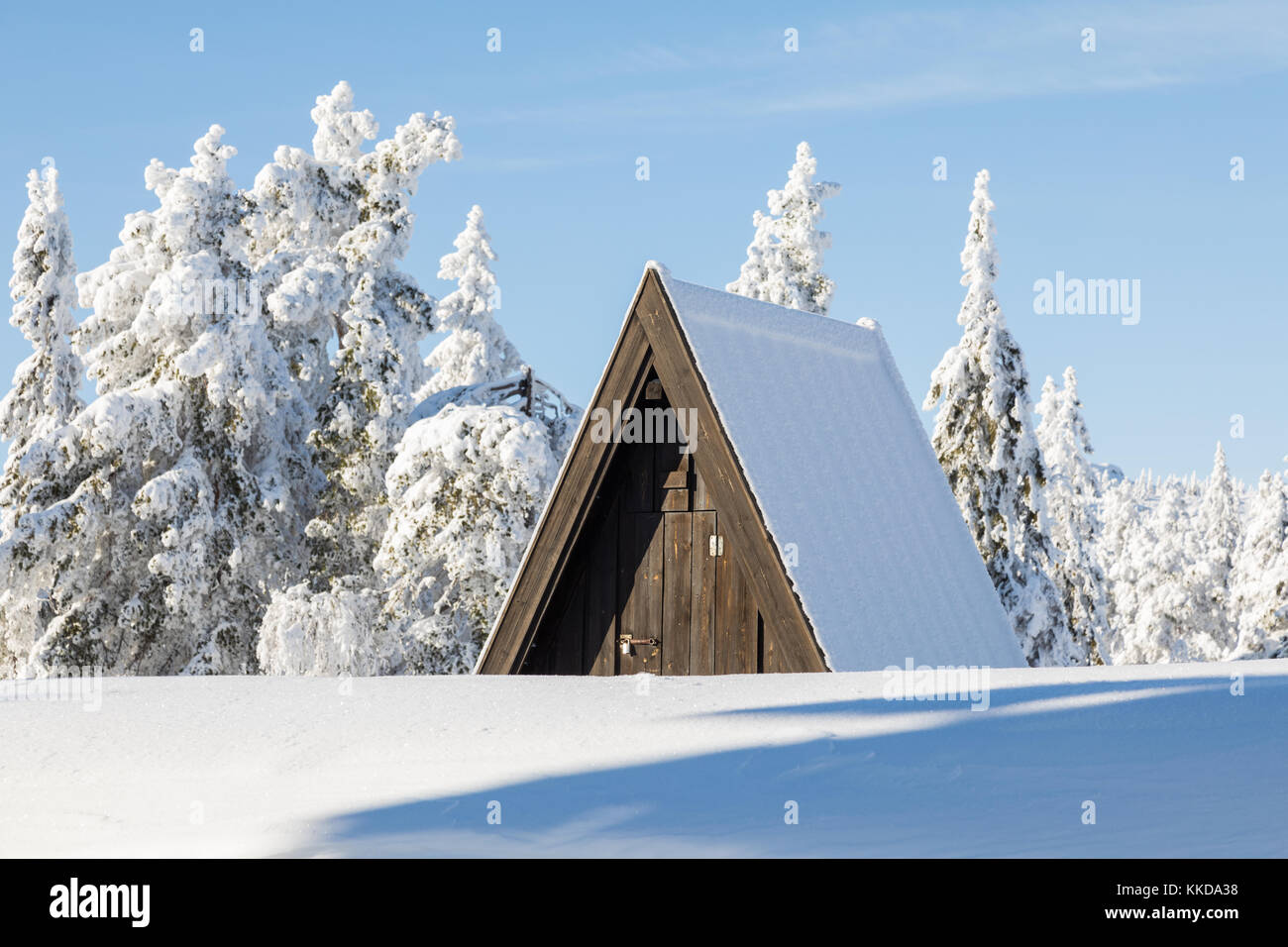 Water control hut in the winter covered in snow Stock Photo