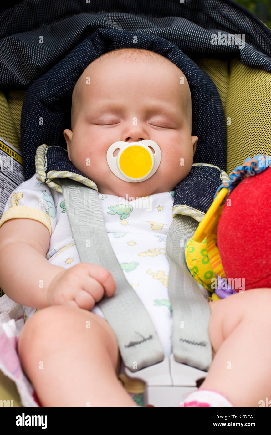 Little baby sleeping in a car seat Stock Photo Alamy