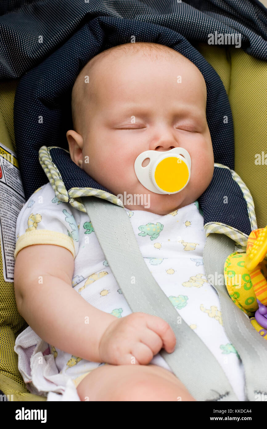 Little baby sleeping in a car seat Stock Photo Alamy