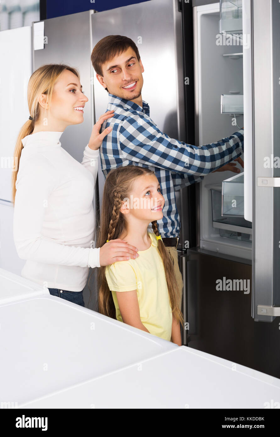 https://c8.alamy.com/comp/KKDDBK/happy-family-selecting-refrigerator-in-appliance-store-KKDDBK.jpg
