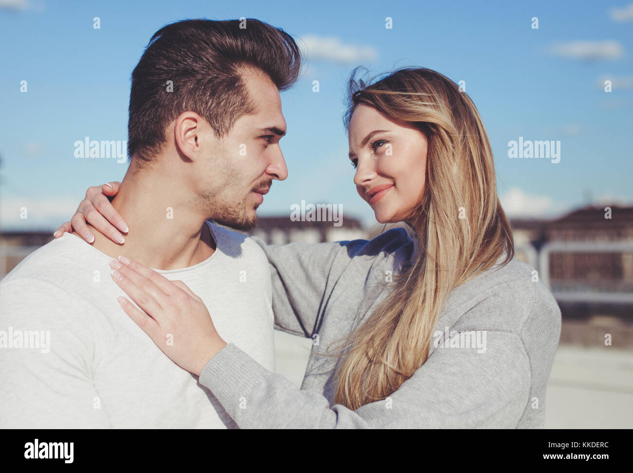 Young casual caucasian couple looking each other outdoors portrait ...
