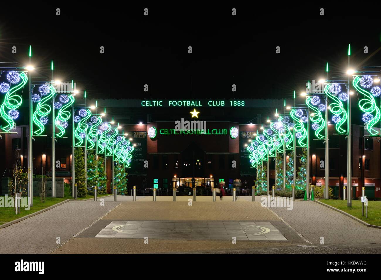 The Celtic Way adorned with festive christmas lights leading up to Celtic Park football stadium at night in Glasgow, Scotland, UK Stock Photo