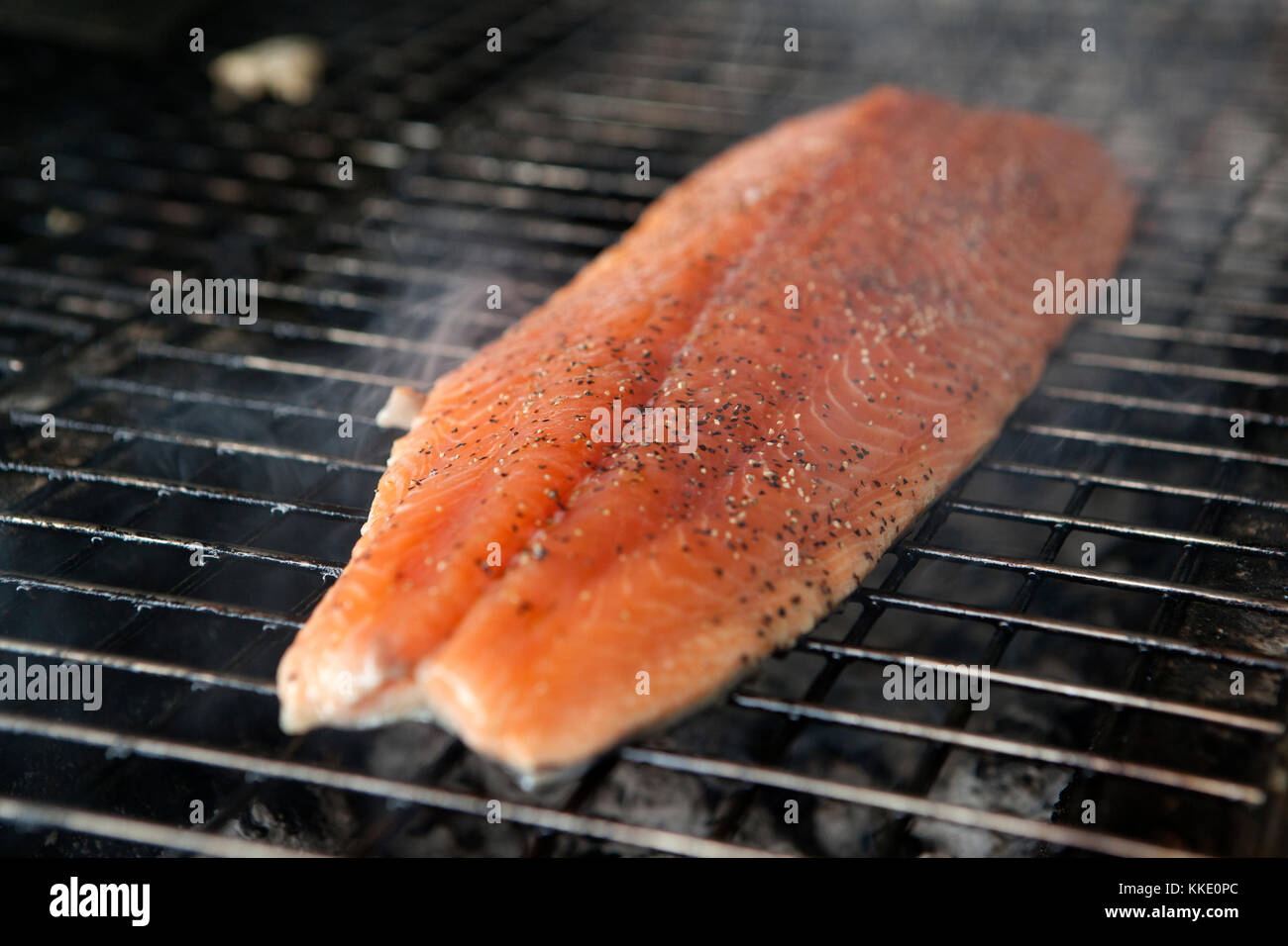 A side of salmon grilling on a barbecue Stock Photo Alamy