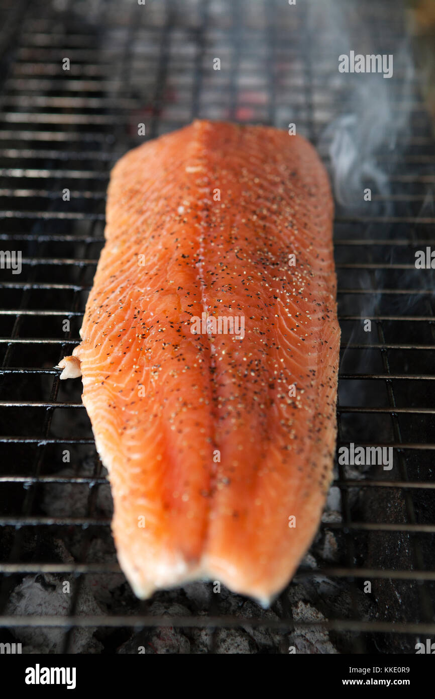 A side of salmon grilling on a barbecue Stock Photo Alamy