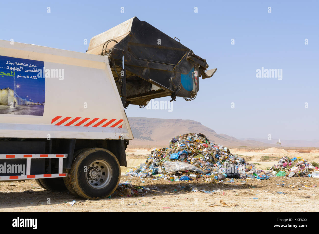 Truck dumping domestic garbage on a landfill site Stock Photo