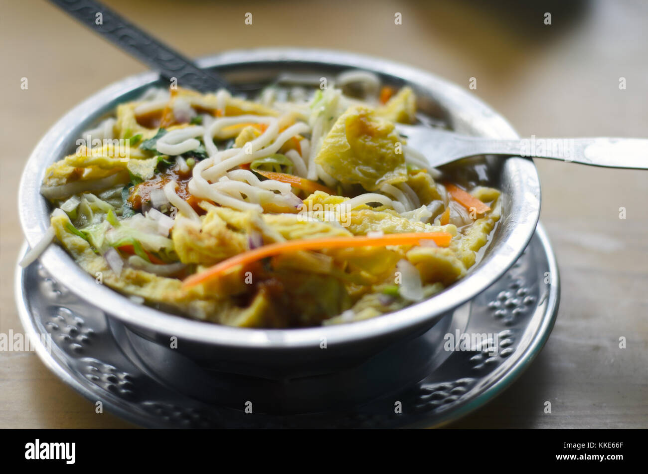 Bowl of thukpa - traditional noodle soup with vegetables in Nepal and Tibet Stock Photo