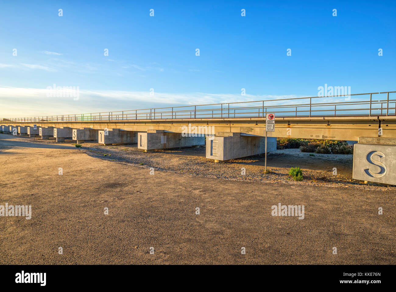 Train tracks at San Onofre State Beach. San Clemente, California. This leads to a surfing spot known as Trestles. Stock Photo