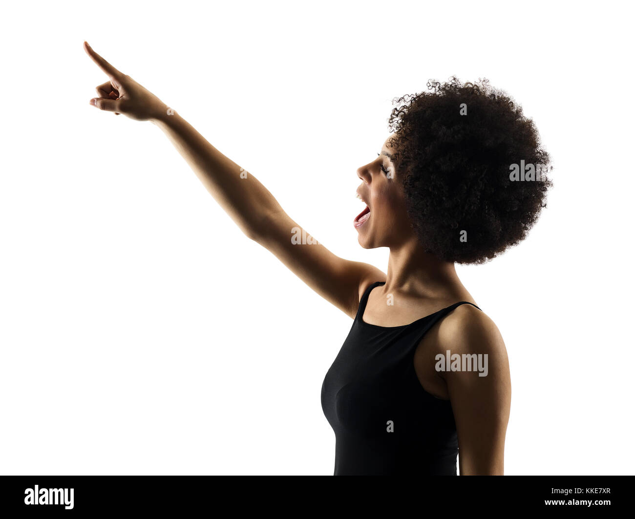 one mixed race african young teenager girl woman pointing  in studio shadow silhouette isolated on white background Stock Photo