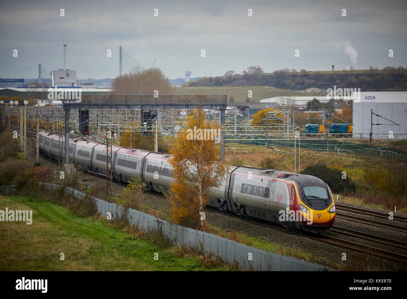 British Rail Class 390 Pendolino train passing Alstom Widnes respraying plant in the Liverpool to London, West Coast Main Line Stock Photo