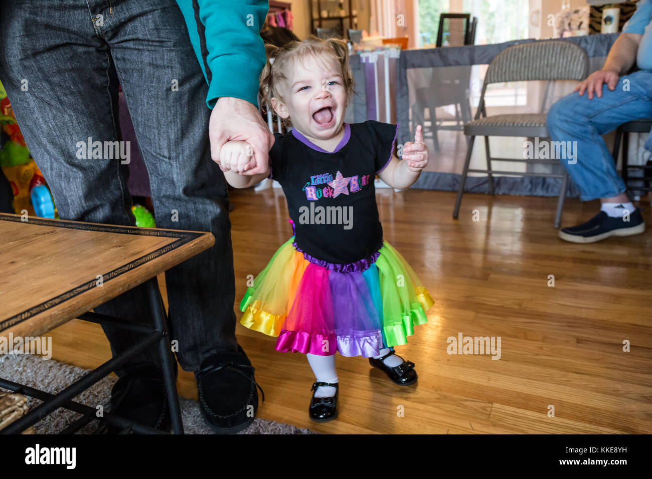 One year old Lily demonstrating her prowess at walking, when Dad gives