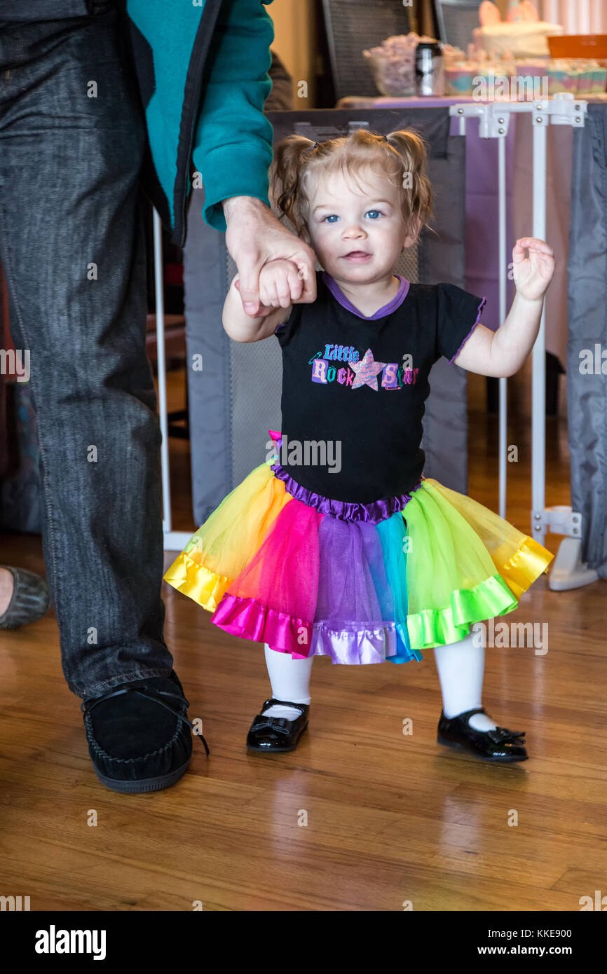 One year old Lily demonstrating her prowess at walking, when Dad gives