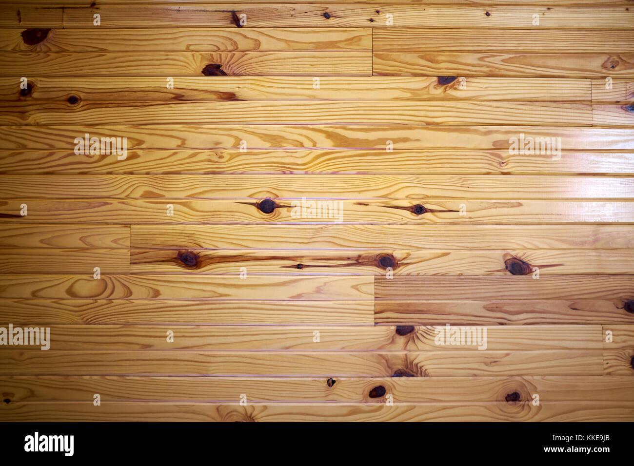 Varnished hardwood floor with distinctive grain, knots and natural