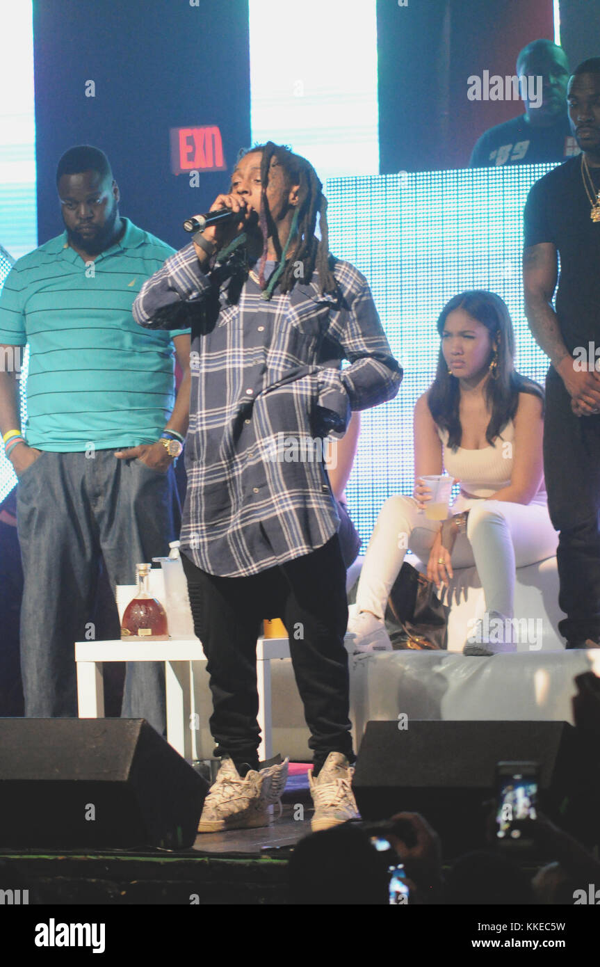 FORT LAUDERDALE, FL - MARCH 23: One of Lil Wayne’s bodyguards waded through the crowd at a Florida show early Sunday and decked a fan who had apparently ticked off the rapper, a new video shows.  The 32-year-old hip hop star appeared to single out the bearded young show-goer before the vicious attack at Revolution Live in Fort Lauderdale, the Broward-Palm Beach New Times reported. on March 23, 2015 in Fort Lauderdale, Florida.   People:  Lil Wayne Stock Photo