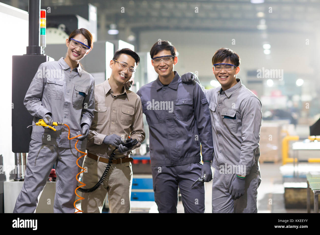 Confident Chinese engineering team in the factory Stock Photo Alamy