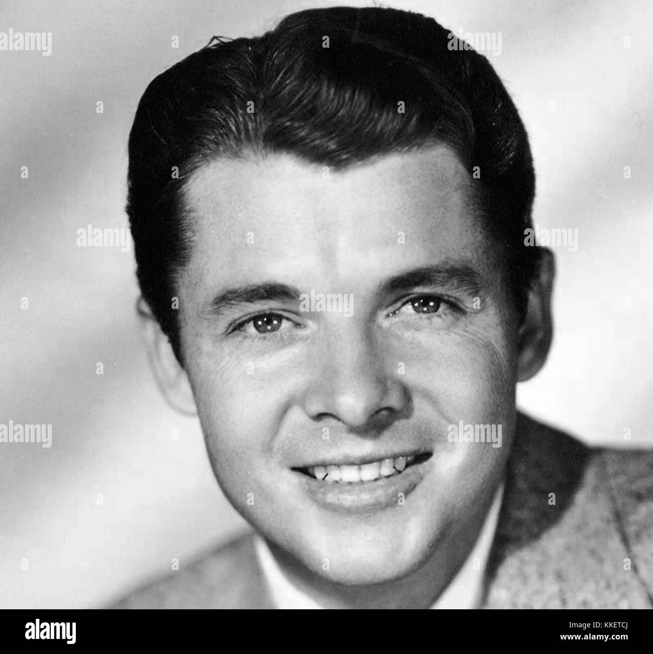This iconic publicity photo features Audie Murphy, one of America's most decorated war heroes, known for his bravery during World War II. The image promotes his legacy and contributions to military history. Stock Photo