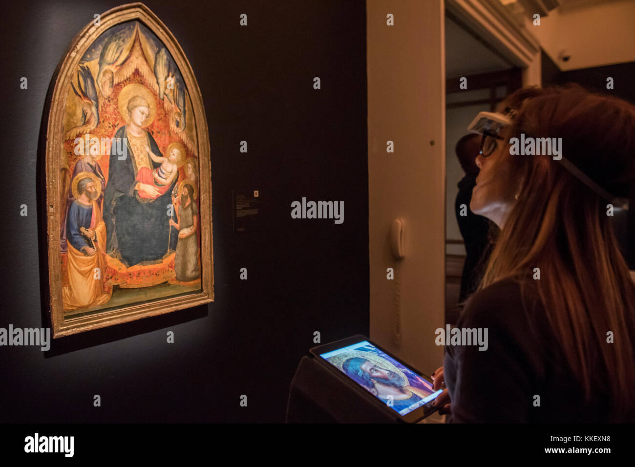 London, UK. 1st December, 2017. Mariotto di Nardo, THE MADONNA AND CHILD ENTHRONED, WITH SAINT PETER, SAINT JOHN THE BAPTIST, SAINT CATHERINE OF ALEXANDRIA AND ONE OTHER FEMALE SAINT AND ANGELS, £200,000-300,000 - London Old Masters Evening sale exhibition at Sotheby's New Bond Street. The sale takes palce on 6 December 2017 covers 400 years of art history. Credit: Guy Bell/Alamy Live News Stock Photo