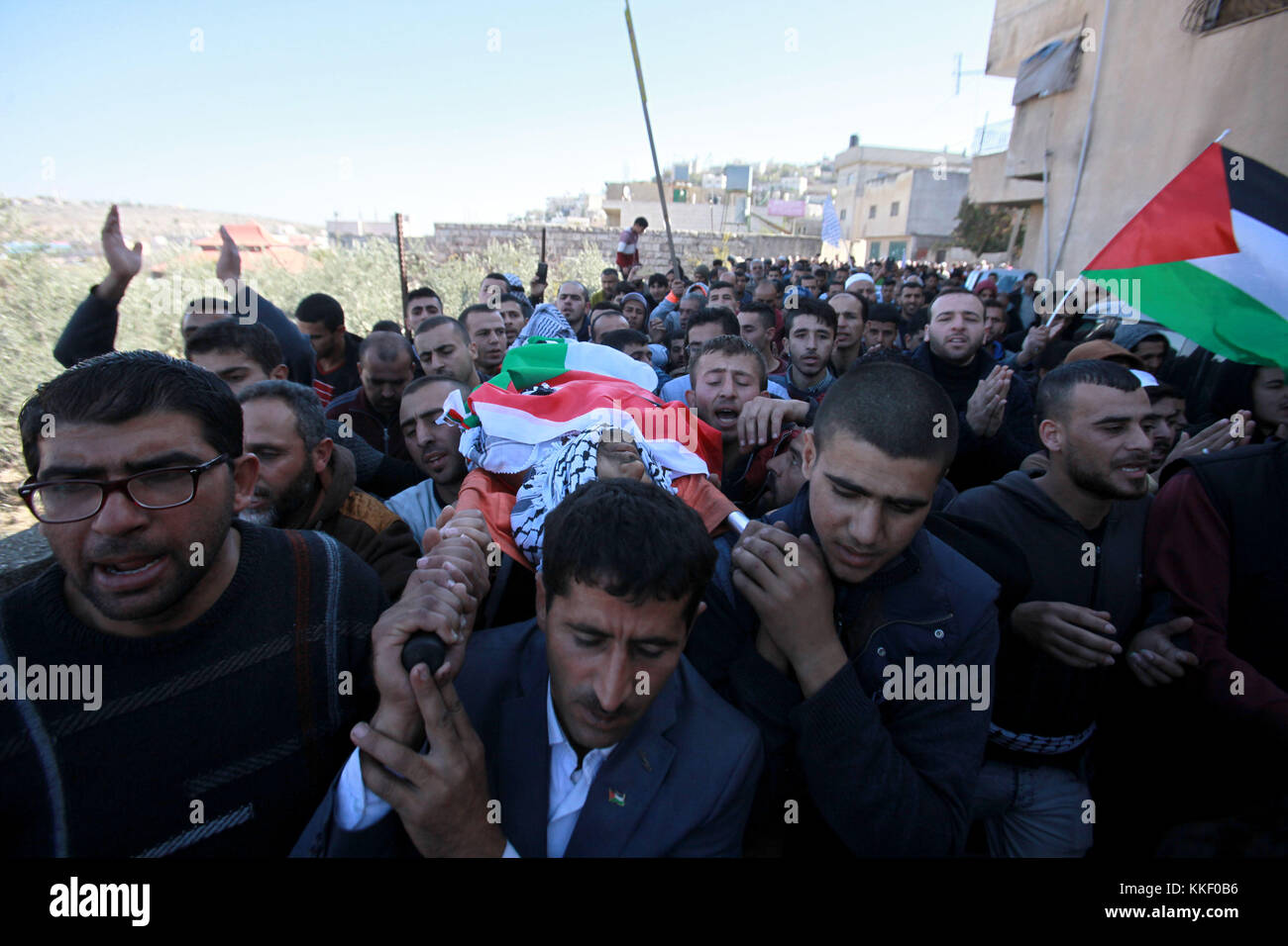 (171202) -- NABLUS, Dec. 2, 2017 (Xinhua)-- Palestinian carry the body of Mahmoud Odeh, 48, during his funeral in the village of Qusra, near the West Bank City of Nablus, on Dec. 2, 2017. Mahmoud Odeh was shot dead by a Jewish settler in Qusra village near Nablus city, north West Bank, Palestinian sources said Thursday. (Xinhua/Nidal Eshtayeh)(zf) Stock Photo