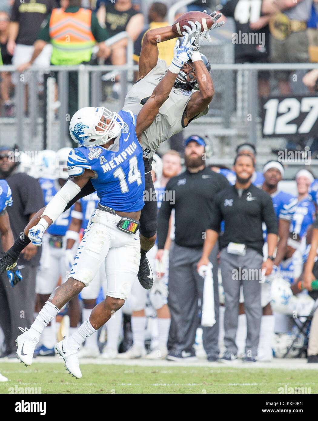 Orlando, FL, USA. 2nd Dec, 2017. UCF receiver Tre'Quan Smith #4 catches a long pass over the arms of Memphis defender Jonathan Cook #14 during the AAC Championship football game between the UCF Knights and the Memphis Tigers at the Spectrum Stadium in Orlando, FL. Kyle Okita/CSM/Alamy Live News Stock Photo