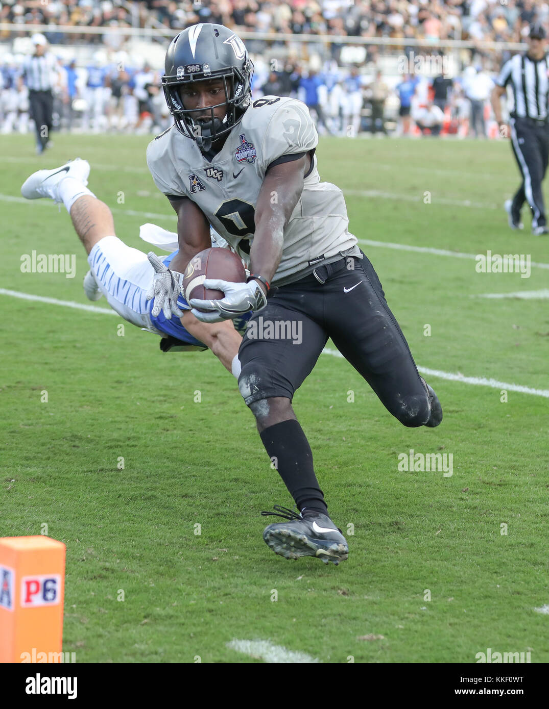 UCF RB Adrian Killins Jr. 2nd Dec, 2017. #9 reaches for the pylon to score a touchdown during overtime of the AAC Championship football game between the UCF Knights and the Memphis Tigers at the Spectrum Stadium in Orlando, FL. Kyle Okita/CSM/Alamy Live News Stock Photo