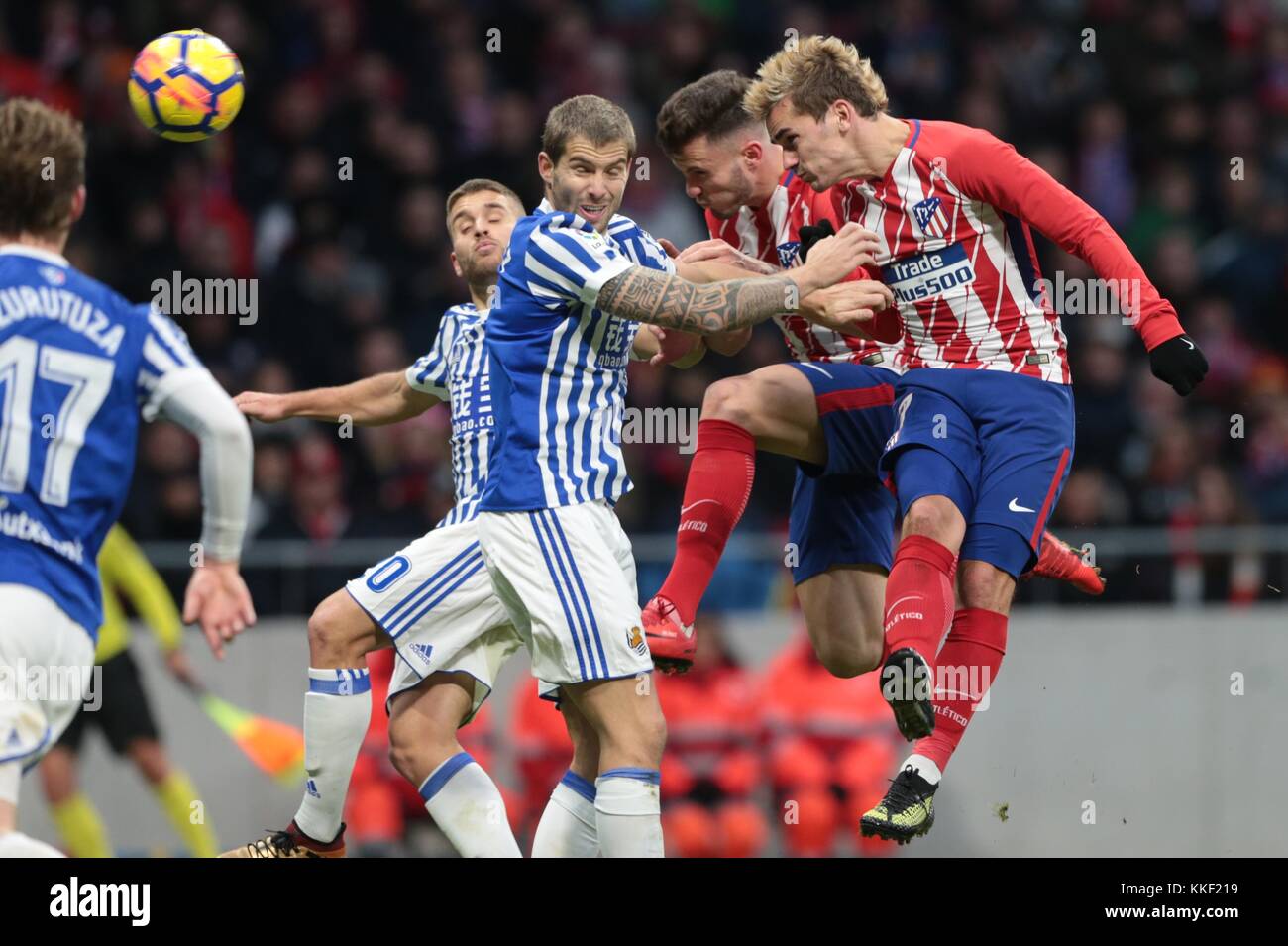 Madrid, Spain. 2nd Dec, 2017. Atletico de Madrid's Griezmann (1st R) competes for a header during a Spanish League match between Atletico de Madrid and Real Sociedad in, Madrid, Spain, Dec 2, 2017. Atletico de Madrid won 2-1. Credit: Juan Carlos Rojas/Xinhua/Alamy Live News Stock Photo